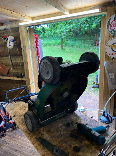 Freshly sharpened mower blades ready to refit