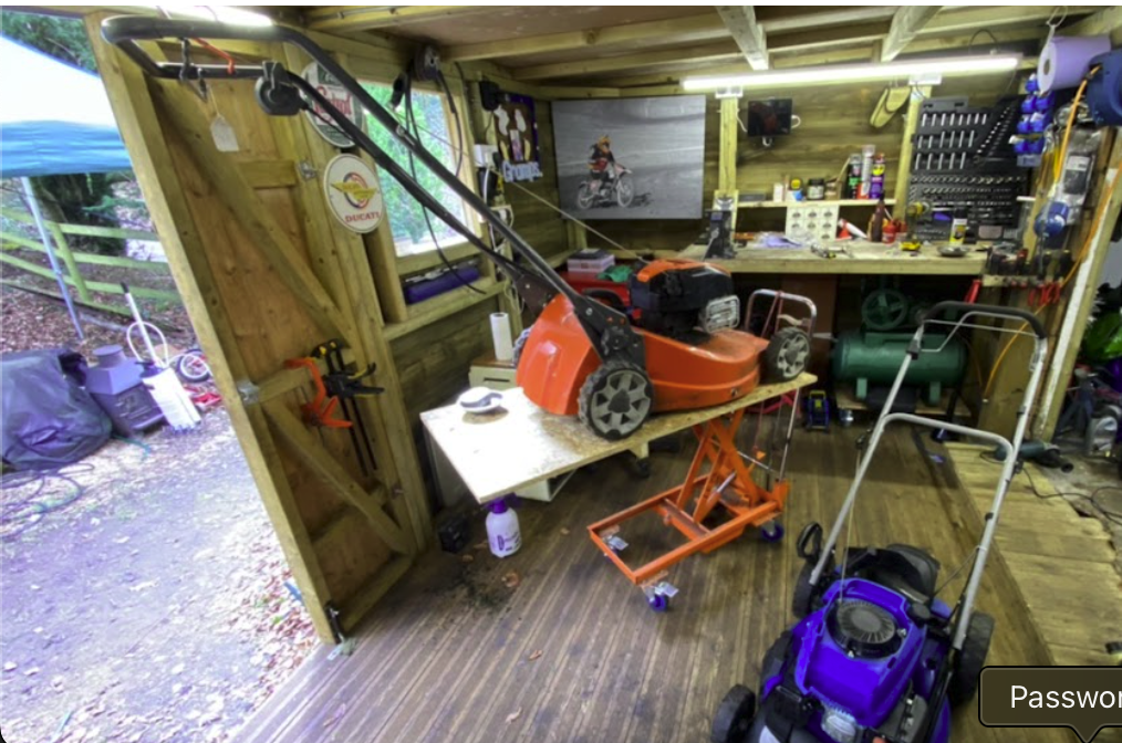 Workshop interior with garden machinery being repaired